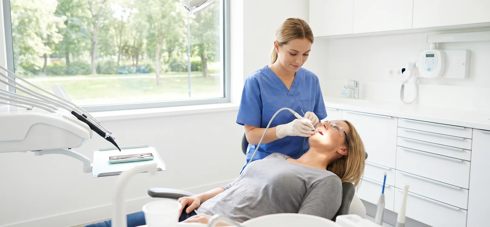 Hygienist performing a gentle dental cleaning